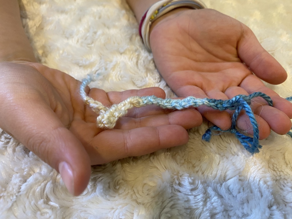 Hand crocheted single line.