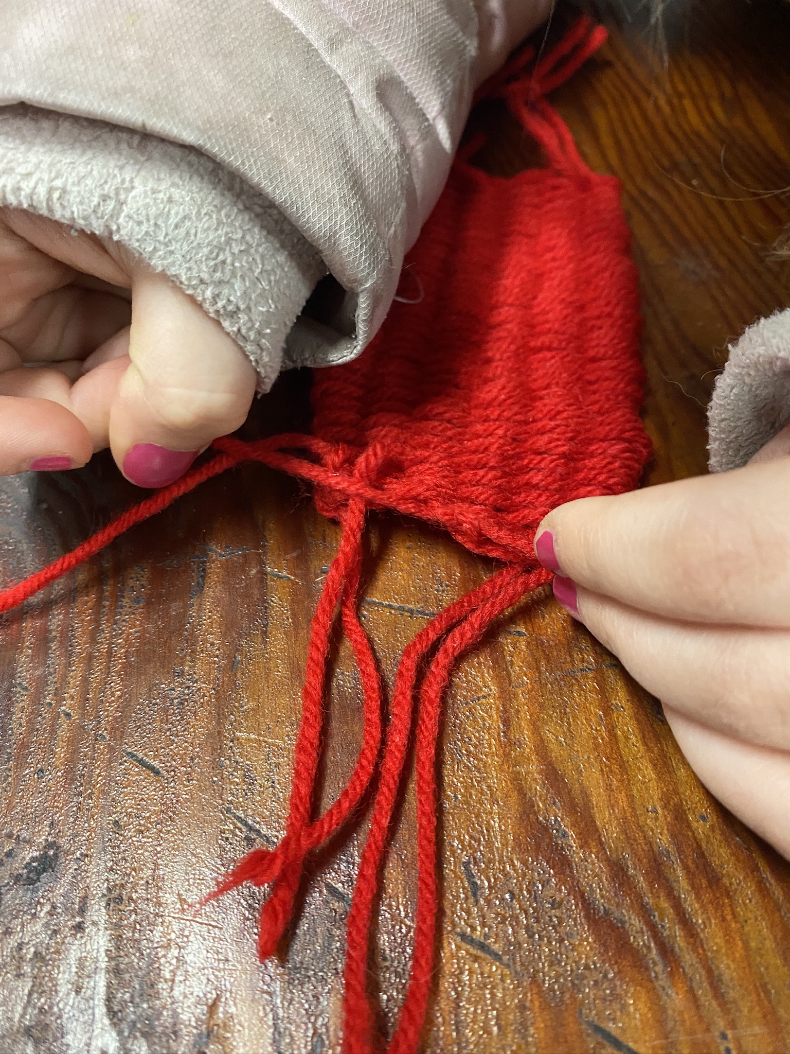 Hand weaving with a cardboard loom.